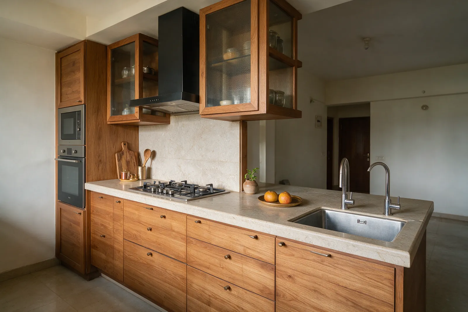A modular kitchen with warm wood cabinets and a stone countertop