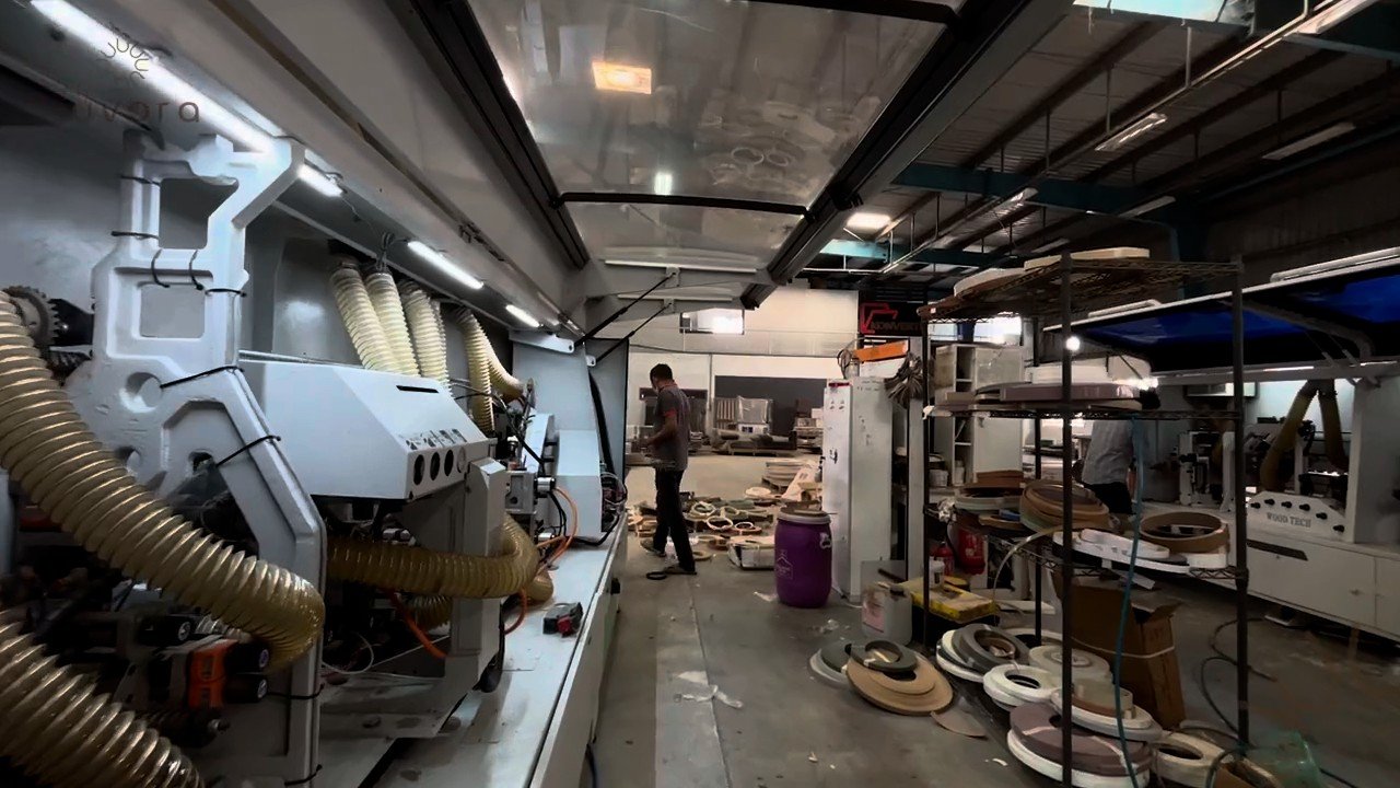 Automatic edge-banding line with edge tape rolls