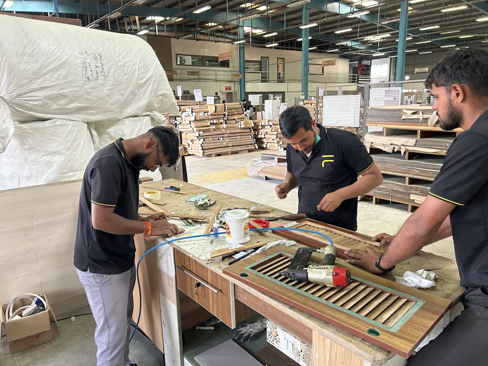 Nuvora artisans finishing furniture by hand